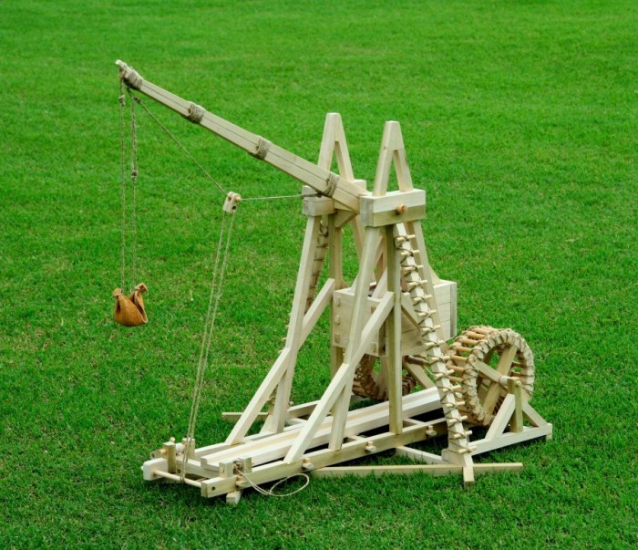 A catapult launches a boulder